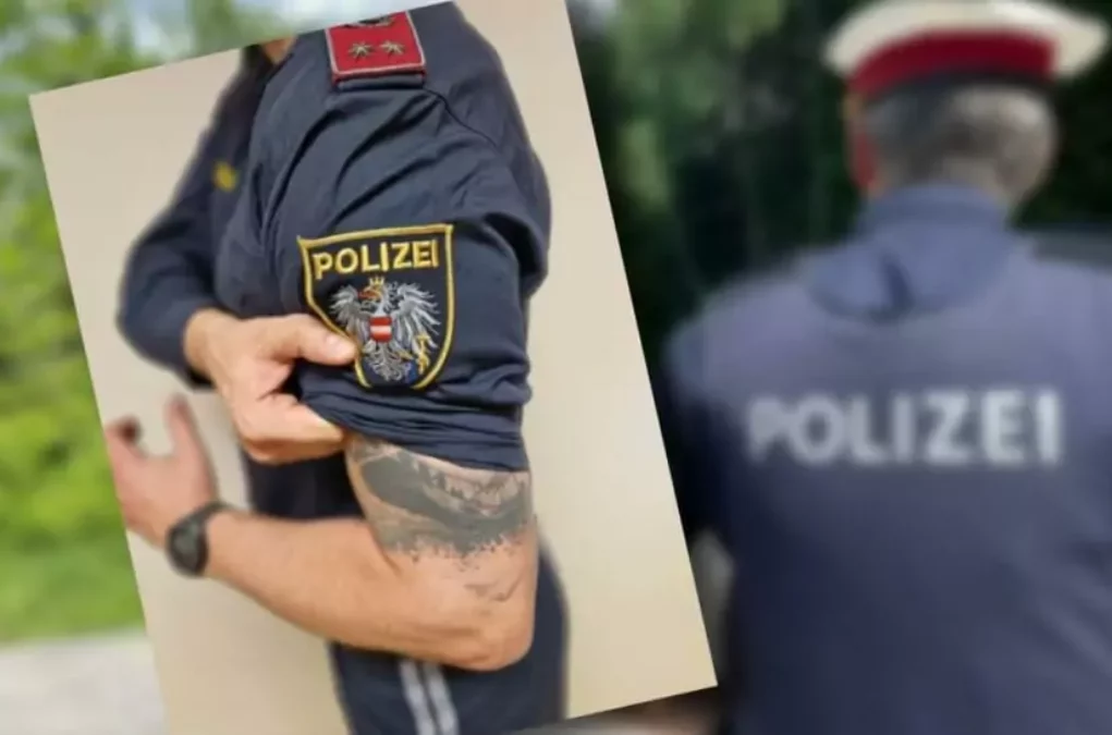 Bild auf 5min.at zeigt einen Polizisten mit Tattoos.