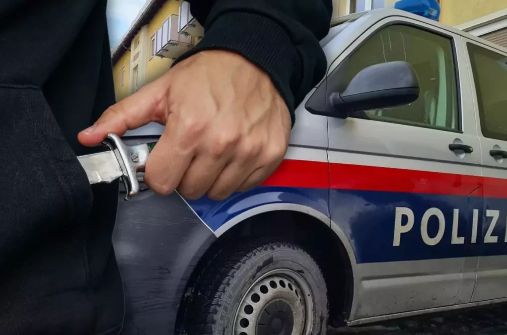 Bild auf 5min.at zeigt einen Mann mit Messer und ein Polizeiauto.