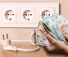 Symbolfoto von 5min.at: Fotomontage von Geld und einer Steckdose.