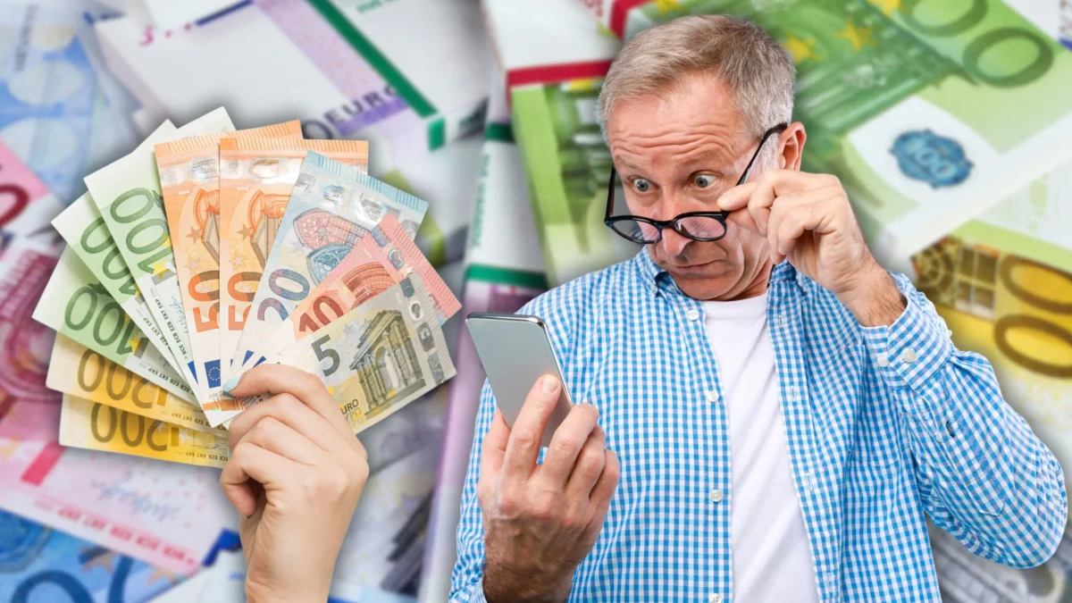 Foto in Beitrag von 5min.at zeigt einen Mann, der verblüfft auf sein Handy schaut, daneben eine Hand mit einigen Euroscheinen und im Hintergrund noch sehr viel Geld verschwommen.