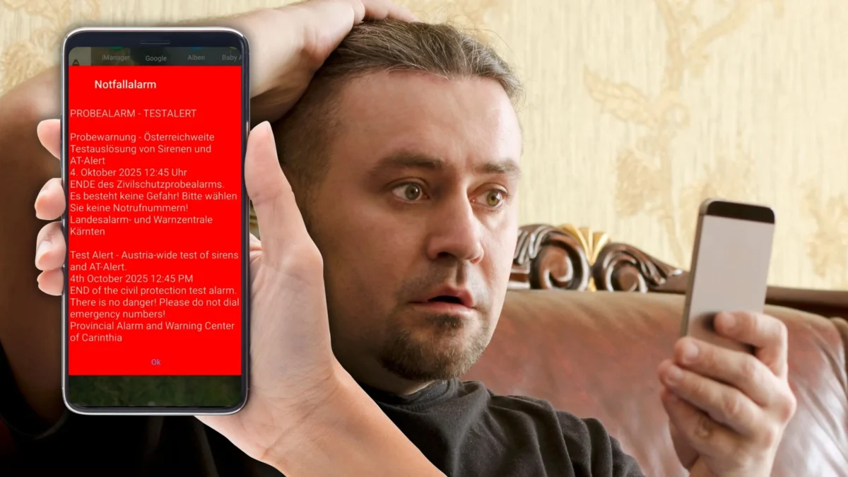 Foto in Beitrag von 5min.at zeigt die Probewarnung und einen Mann mit Handy in der Hand.