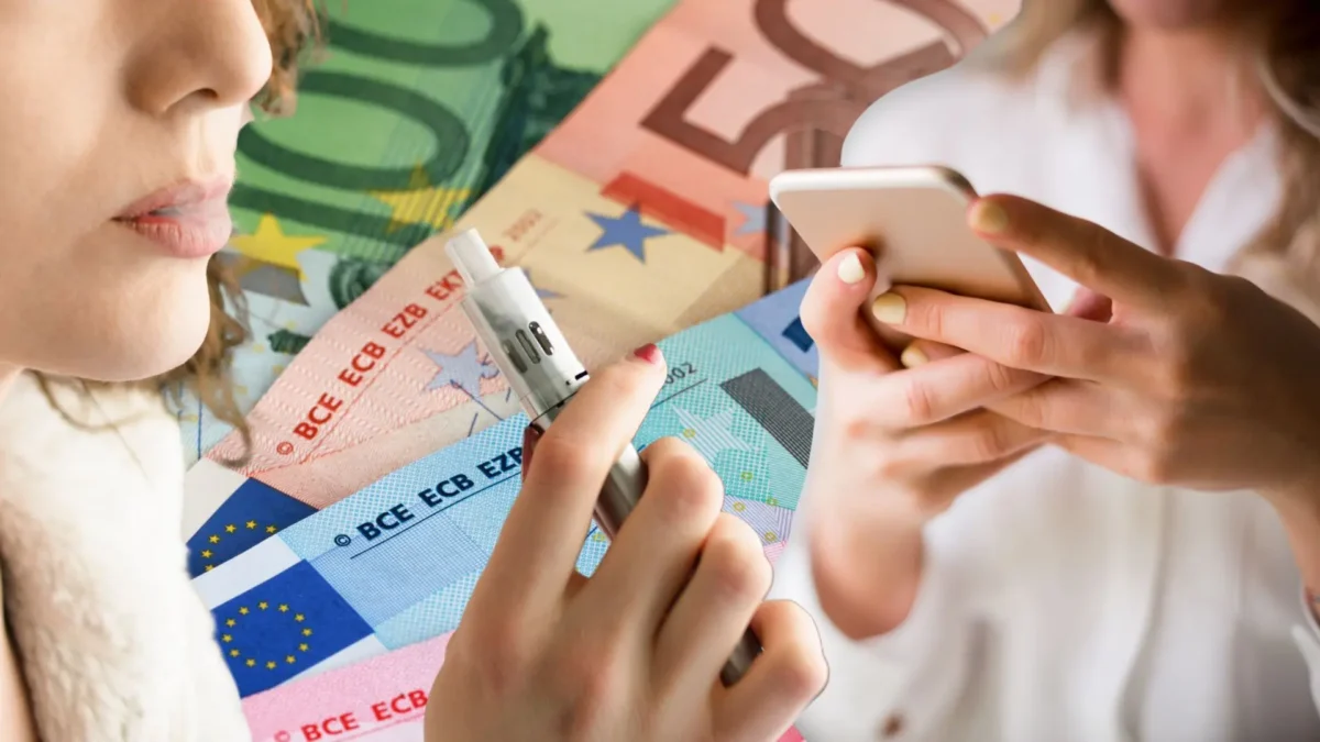 Das Bild auf 5min.at zeigt Geld, E-Zigaretten und eine Frau, die ein Handy in der Hand hält.